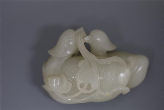 A good Chinese white jade group of two mandarin ducks biting lotus tendrils, 18th/19th century, L. 7.2cm